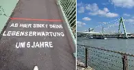 Was bedeutet der ominöse Spruch auf den Kölner Brücken?