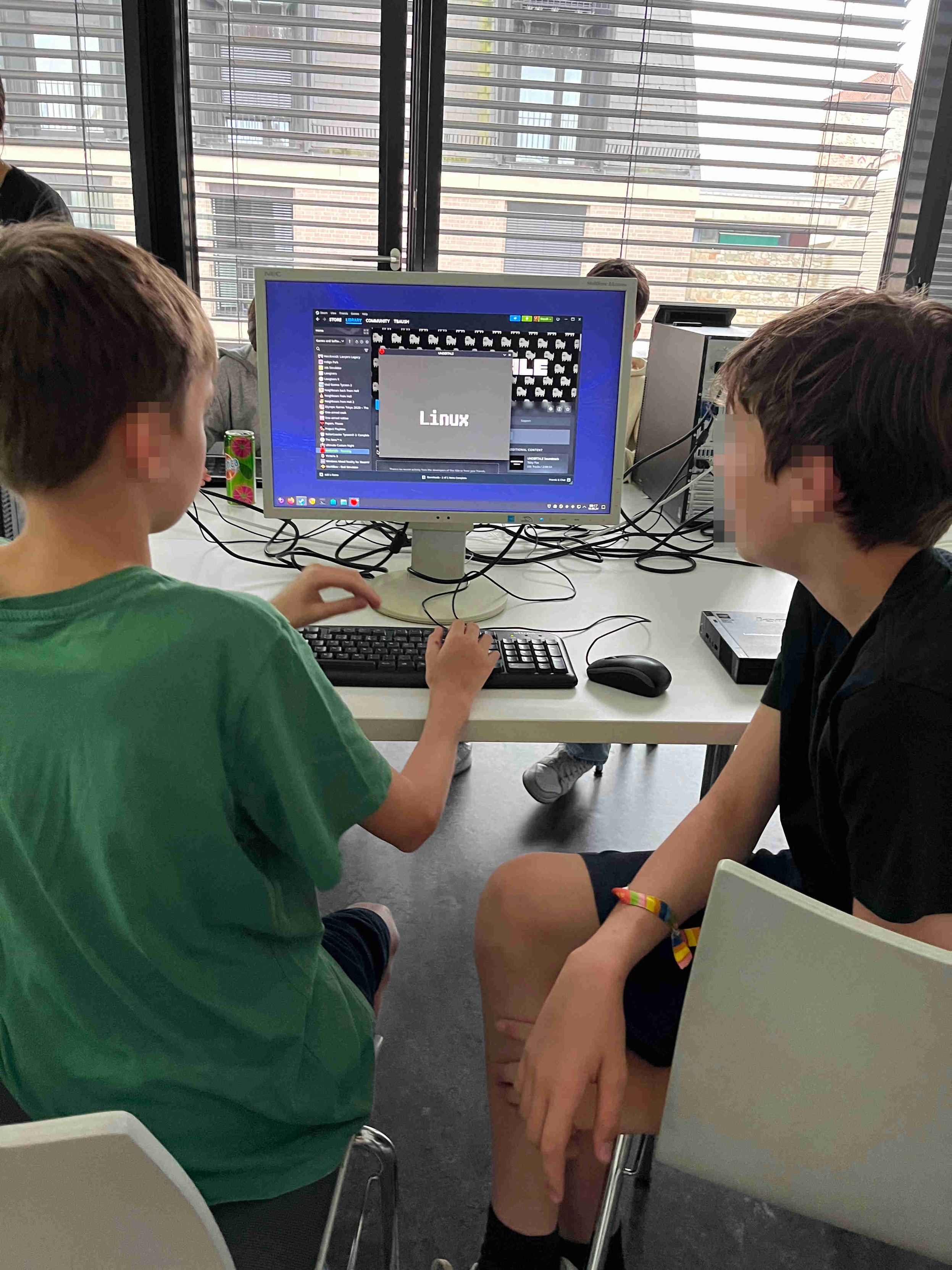 Two ninth graders are shown using the Bazzite gaming distribution (built from Fedora Kinoite with KDE Plasma): https://bazzite.gg/.

The students flashed the USB drive and installed the operating system all by themselves.