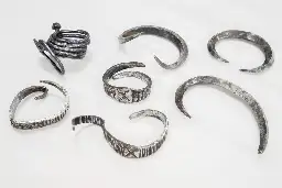 Archaeology Student Discovers Trove of Silver Viking Age Armbands in Denmark