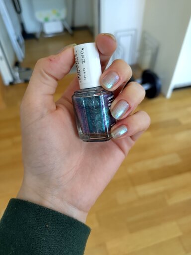 Pic of a beautiful glitter polish and some nails with the polish on them, not looking as good as the bottle 